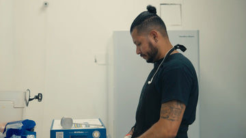 kitchen chef cutting chicken and working