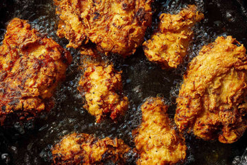 fried chicken in deep fryer using frying oil