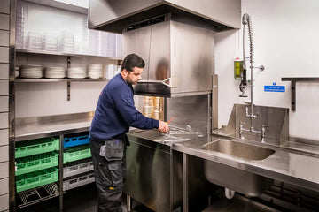 restaurant owner cleaning up kitchen