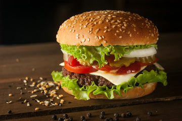 juicy hamburger with lettuce talking about frying oil costs going up