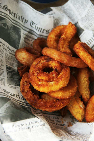 food on a newspaper fried food that taste different