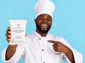black chef holding purimax filter powder and pointing at it